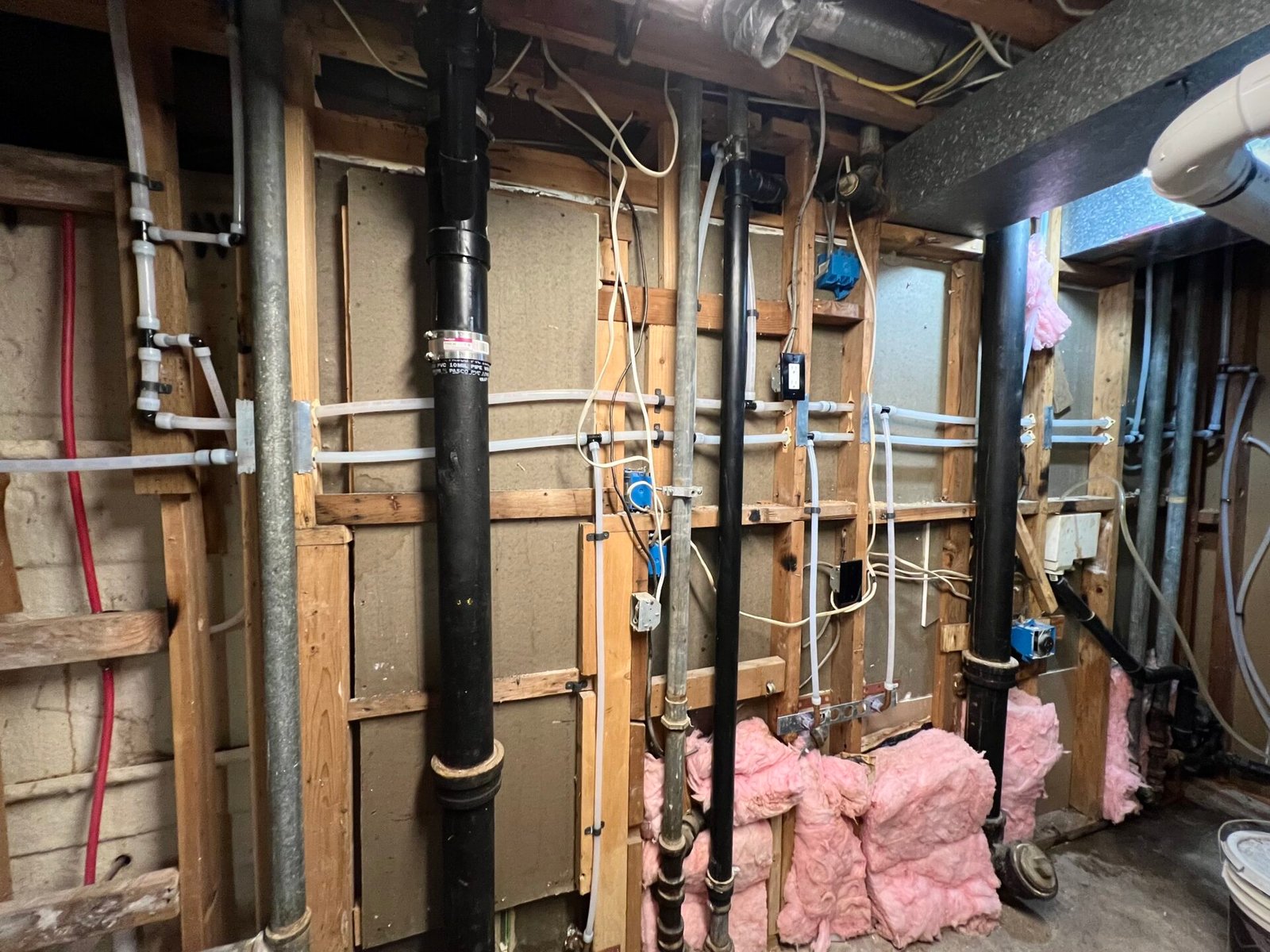 About - Evergreen Plumbing Authority Plumber replacing old copper piping with PEX in crawl space